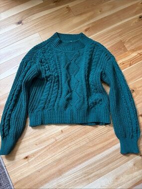 Cropped cable knit sweater
